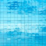 Clouds,Reflected,In,Windows,Of,Modern,Office,Building